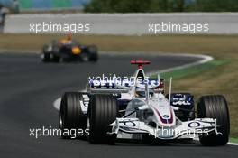 16.07.2006 Magny Cours, France,  Nick Heidfeld (GER), BMW Sauber F1 Team, F1.06 leads David Coulthard (GBR), Red Bull Racing, RB2 - Formula 1 World Championship, Rd 11, French Grand Prix, Sunday Race