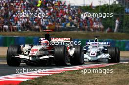 16.07.2006 Magny Cours, France,  Rubens Barrichello (BRA), Honda Racing F1 Team RA106, leads Jacques Villeneuve (CAN), BMW Sauber F1 Team F1.06 - Formula 1 World Championship, Rd 11, French Grand Prix, Sunday Race