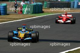 16.07.2006 Magny Cours, France,  Fernando Alonso (ESP), Renault F1 Team R26, leading Michael Schumacher (GER), Scuderia Ferrari 248 F1 - Formula 1 World Championship, Rd 11, French Grand Prix, Sunday Race