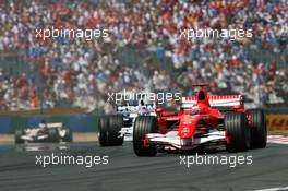 16.07.2006 Magny Cours, France,  Michael Schumacher (GER), Scuderia Ferrari, 248 F1 leads Jacques Villeneuve (CDN), BMW Sauber F1 Team, F1.06 - Formula 1 World Championship, Rd 11, French Grand Prix, Sunday Race