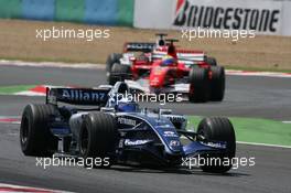 16.07.2006 Magny Cours, France,  Nico Rosberg (GER), WilliamsF1 Team, FW28 Cosworth leads Felipe Massa (BRA), Scuderia Ferrari, 248 F1 - Formula 1 World Championship, Rd 11, French Grand Prix, Sunday Race