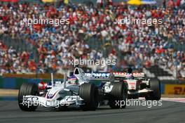 16.07.2006 Magny Cours, France,  Jenson Button (GBR), Honda Racing F1 Team, RA106 leads Jenson Button (GBR), Honda Racing F1 Team, RA106 - Formula 1 World Championship, Rd 11, French Grand Prix, Sunday Race