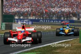 16.07.2006 Magny Cours, France,  Felipe Massa (BRA), Scuderia Ferrari 248 F1, leads Fernando Alonso (ESP), Renault F1 Team R26 - Formula 1 World Championship, Rd 11, French Grand Prix, Sunday Race