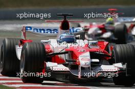 16.07.2006 Magny Cours, France,  Jarno Trulli (ITA), Toyota Racing, TF106 leads Ralf Schumacher (GER), Toyota Racing, TF106 - Formula 1 World Championship, Rd 11, French Grand Prix, Sunday Race