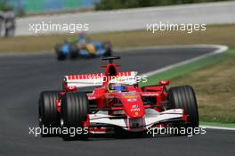 16.07.2006 Magny Cours, France,  Felipe Massa (BRA), Scuderia Ferrari, 248 F1 leads Fernando Alonso (ESP), Renault F1 Team, R26 - Formula 1 World Championship, Rd 11, French Grand Prix, Sunday Race