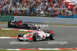 16.07.2006 Magny Cours, France,  Franck Montagny (FRA), Super Aguri F1 and Vitantonio Liuzzi (ITA), Scuderia Toro Rosso, STR01 - Formula 1 World Championship, Rd 11, French Grand Prix, Sunday Race