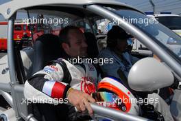 16.07.2006 Magny Cours, France,  Rubens Barrichello (BRA), Honda Racing F1 Team, Portrait, being brought back to the pits after his retirement - Formula 1 World Championship, Rd 11, French Grand Prix, Sunday Race