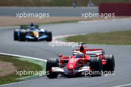 16.07.2006 Magny Cours, France,  Felipe Massa (BRA), Scuderia Ferrari 248 F1, leads Fernando Alonso (ESP), Renault F1 Team R26 - Formula 1 World Championship, Rd 11, French Grand Prix, Sunday Race