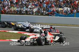 16.07.2006 Magny Cours, France,  Rubens Barrichello (BRA), Honda Racing F1 Team, RA106, Scott Speed (USA), Scuderia Toro Rosso, STR01  - Formula 1 World Championship, Rd 11, French Grand Prix, Sunday Race