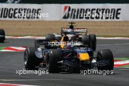 16.07.2006 Magny Cours, France,  Christian Klien (AUT), Red Bull Racing, RB2 leads Jenson Button (GBR), Honda Racing F1 Team, RA106 - Formula 1 World Championship, Rd 11, French Grand Prix, Sunday Race