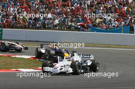 16.07.2006 Magny Cours, France,  Jacques Villeneuve (CDN), BMW Sauber F1 Team, F1.06 and Christian Klien (AUT), Red Bull Racing, RB2 - Formula 1 World Championship, Rd 11, French Grand Prix, Sunday Race