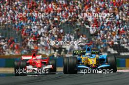 16.07.2006 Magny Cours, France,  Fernando Alonso (ESP), Renault F1 Team, R26 leads Michael Schumacher (GER), Scuderia Ferrari, 248 F1 - Formula 1 World Championship, Rd 11, French Grand Prix, Sunday Race