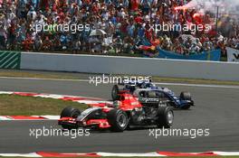 16.07.2006 Magny Cours, France,  Tiago Monteiro (POR), Midland MF1 Racing, Toyota M16 and Nico Rosberg (GER), WilliamsF1 Team, FW28 Cosworth - Formula 1 World Championship, Rd 11, French Grand Prix, Sunday Race