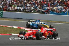 16.07.2006 Magny Cours, France,  Felipe Massa (BRA), Scuderia Ferrari, 248 F1, Fernando Alonso (ESP), Renault F1 Team, R26 - Formula 1 World Championship, Rd 11, French Grand Prix, Sunday Race