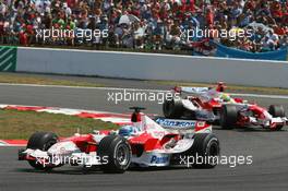 16.07.2006 Magny Cours, France,  Jarno Trulli (ITA), Toyota Racing, TF106 and Ralf Schumacher (GER), Toyota Racing, TF106 - Formula 1 World Championship, Rd 11, French Grand Prix, Sunday Race