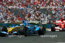 16.07.2006 Magny Cours, France,  Fernando Alonso (ESP), Renault F1 Team, R26 leads Michael Schumacher (GER), Scuderia Ferrari, 248 F1 - Formula 1 World Championship, Rd 11, French Grand Prix, Sunday Race