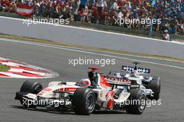 16.07.2006 Magny Cours, France,  Rubens Barrichello (BRA), Honda Racing F1 Team, RA106 and Jacques Villeneuve (CDN), BMW Sauber F1 Team, F1.06 - Formula 1 World Championship, Rd 11, French Grand Prix, Sunday Race