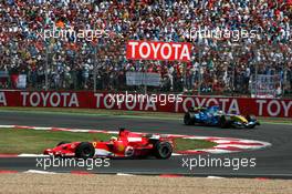 16.07.2006 Magny Cours, France,  Felipe Massa (BRA), Scuderia Ferrari 248 F1, leads Fernando Alonso (ESP), Renault F1 Team R26 - Formula 1 World Championship, Rd 11, French Grand Prix, Sunday Race