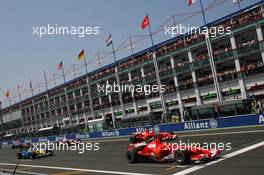 16.07.2006 Magny Cours, France,  Michael Schumacher (GER), Scuderia Ferrari, 248 F1 leads the start of the race - Formula 1 World Championship, Rd 11, French Grand Prix, Sunday Race