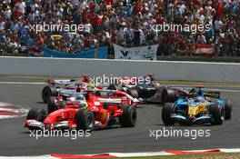 16.07.2006 Magny Cours, France,  Start, Michael Schumacher (GER), Scuderia Ferrari, 248 F1, Fernando Alonso (ESP), Renault F1 Team, R26, Jarno Trulli (ITA), Toyota Racing, TF106, Ralf Schumacher (GER), Toyota Racing, TF106, Kimi Raikkonen (FIN), Räikkönen, McLaren Mercedes, MP4-21 - Formula 1 World Championship, Rd 11, French Grand Prix, Sunday Race