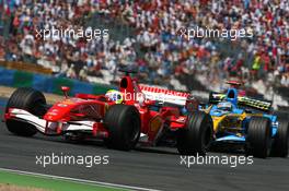 16.07.2006 Magny Cours, France,  Felipe Massa (BRA), Scuderia Ferrari 248 F1, leads Fernando Alonso (ESP), Renault F1 Team R26 - Formula 1 World Championship, Rd 11, French Grand Prix, Sunday Race