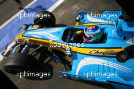 15.07.2006 Magny Cours, France,  Giancarlo Fisichella (ITA), Renault F1 Team R26, driving out of the pitbox - Formula 1 World Championship, Rd 11, French Grand Prix, Saturday Practice