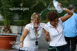 15.07.2006 Magny Cours, France,  Girls from the Red Bull hospitality having fun with some water bottles - Formula 1 World Championship, Rd 11, French Grand Prix, Saturday