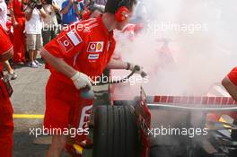 15.07.2006 Magny Cours, France,  Car of Michael Schumacher (GER), Scuderia Ferrari 248 F1, caught fire when returning in the pits - Formula 1 World Championship, Rd 11, French Grand Prix, Saturday Practice