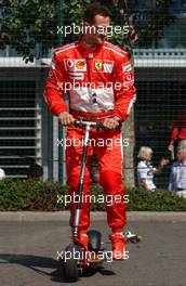 15.07.2006 Magny Cours, France,  Michael Schumacher (GER), Scuderia Ferrari 248 F1, on a small step, with some empty cans hanging behind his step which Bridgestone engineers put behind it - Formula 1 World Championship, Rd 11, French Grand Prix, Saturday