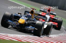 15.07.2006 Magny Cours, France,  David Coulthard (GBR), Red Bull Racing, RB2, Tiago Monteiro (POR), Midland MF1 Racing, Toyota M16 - Formula 1 World Championship, Rd 11, French Grand Prix, Saturday Qualifying