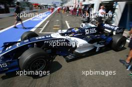 15.07.2006 Magny Cours, France,  Nico Rosberg (GER), WilliamsF1 Team FW28, driving out of the pitbox - Formula 1 World Championship, Rd 11, French Grand Prix, Saturday Practice