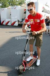 15.07.2006 Magny Cours, France,  Michael Schumacher (GER), Scuderia Ferrari, Portrait, in the paddock on a step - Formula 1 World Championship, Rd 11, French Grand Prix, Saturday