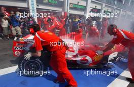 15.07.2006 Magny Cours, France,  The car of Michael Schumacher (GER), Scuderia Ferrari 248 F1, caught fire when returning into the pits - Formula 1 World Championship, Rd 11, French Grand Prix, Saturday Practice