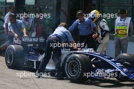 15.07.2006 Magny Cours, France,  Nico Rosberg (GER), WilliamsF1 Team, FW28 Cosworth, is pushed into the FIA Scrutineering bay - Formula 1 World Championship, Rd 11, French Grand Prix, Saturday Qualifying