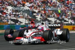 15.07.2006 Magny Cours, France,  Franck Montagny (FRA), Super Aguri F1 SA05 and Vitantonio Liuzzi (ITA), Scuderia Toro Rosso STR 01 - Formula 1 World Championship, Rd 11, French Grand Prix, Saturday Qualifying