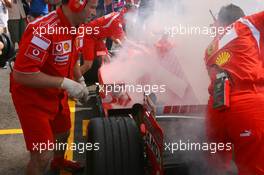 15.07.2006 Magny Cours, France,  Car of Michael Schumacher (GER), Scuderia Ferrari 248 F1, caught fire when returning in the pits - Formula 1 World Championship, Rd 11, French Grand Prix, Saturday Practice