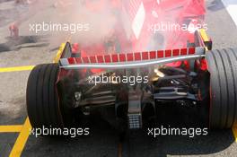 15.07.2006 Magny Cours, France,  Car of Michael Schumacher (GER), Scuderia Ferrari 248 F1, caught fire when returning in the pits - Formula 1 World Championship, Rd 11, French Grand Prix, Saturday Practice