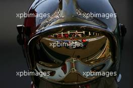 15.07.2006 Magny Cours, France,  Kimi Raikkonen (FIN), Räikkönen, McLaren Mercedes, MP4-21 , Reflection in a Fire Marshalls helmet - Formula 1 World Championship, Rd 11, French Grand Prix, Saturday Practice