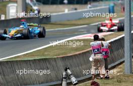 15.07.2006 Magny Cours, France,  Photographers shooting the action - Formula 1 World Championship, Rd 11, French Grand Prix, Saturday Qualifying