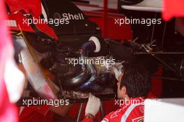 15.07.2006 Magny Cours, France,  Mechanics reparing the damage after the fire on the car of Michael Schumacher (GER), Scuderia Ferrari 248 F1 - Formula 1 World Championship, Rd 11, French Grand Prix, Saturday Practice