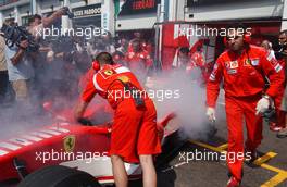 15.07.2006 Magny Cours, France,  The car of Michael Schumacher (GER), Scuderia Ferrari 248 F1, caught fire when returning into the pits - Formula 1 World Championship, Rd 11, French Grand Prix, Saturday Practice