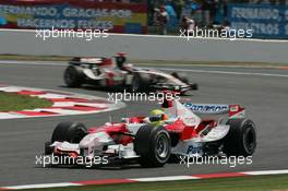 15.07.2006 Magny Cours, France,  Ralf Schumacher (GER), Toyota Racing, TF106 and Rubens Barrichello (BRA), Honda Racing F1 Team, RA106   - Formula 1 World Championship, Rd 11, French Grand Prix, Saturday Qualifying