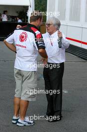 15.07.2006 Magny Cours, France,  Bernie Ecclestone (GBR), CEO of Formula One Management (FOM), talking with Rubens Barrichello (BRA), Honda Racing F1 Team - Formula 1 World Championship, Rd 11, French Grand Prix, Saturday