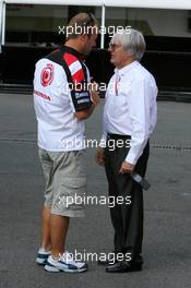 15.07.2006 Magny Cours, France,  Bernie Ecclestone (GBR), CEO of Formula One Management (FOM), talking with Rubens Barrichello (BRA), Honda Racing F1 Team - Formula 1 World Championship, Rd 11, French Grand Prix, Saturday