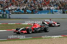 15.07.2006 Magny Cours, France,  Christijan Albers (NED), Midland MF1 Racing, Toyota M16 and Jarno Trulli (ITA), Toyota Racing, TF106  - Formula 1 World Championship, Rd 11, French Grand Prix, Saturday Qualifying