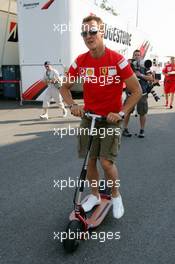 15.07.2006 Magny Cours, France,  Michael Schumacher (GER), Scuderia Ferrari, Portrait, in the paddock on a step - Formula 1 World Championship, Rd 11, French Grand Prix, Saturday