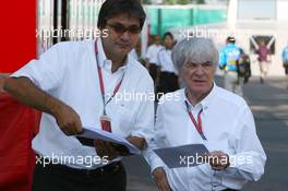 16.07.2006 Magny Cours, France,  Pasquale Lattuneddu (ITA), Chief Operations FOM (left), talking with Bernie Ecclestone (GBR), CEO of Formula One Management (FOM) - Formula 1 World Championship, Rd 11, French Grand Prix, Sunday