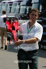 16.07.2006 Magny Cours, France,  Guy with a nice Ferrari model - Formula 1 World Championship, Rd 11, French Grand Prix, Sunday