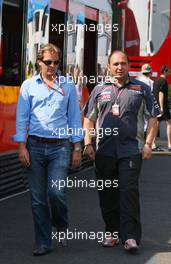 16.07.2006 Magny Cours, France,  Michiel Mol (NDL) Who is said to be the purchaser of Midland MF1 Racing, with Colin Kolles (GER), Midland MF1 Racing, Managing Director - Formula 1 World Championship, Rd 11, French Grand Prix, Sunday