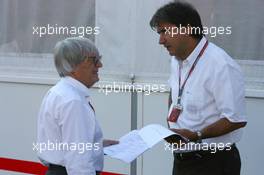 16.07.2006 Magny Cours, France,  Bernie Ecclestone (GBR), CEO of Formula One Management (FOM) (left), talking with Pasquale Lattuneddu (ITA), Chief Operations FOM - Formula 1 World Championship, Rd 11, French Grand Prix, Sunday